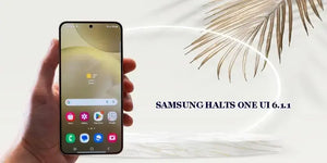 Samsung Halts One UI 6.1.1 displayed on a smartphone with a palm leaf background.